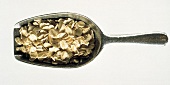 A Metal Scoop Filled with Oat Flakes