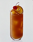 Planter's Punch with orange slices & cherry in tall glass