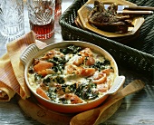 Spinach and tomato gratin with ham strips & lamb cutlets