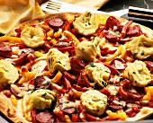 Pizza with artichoke bottoms, peppers, sausage and cheese