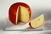 A whole Edam cheese, cut into