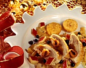 Duck breast on warm fruit salad with potato cakes