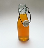 Diluted concentrated apple juice in a glass bottle