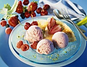 Red berry & yoghurt ice cream with crepes on dessert plate