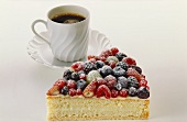 A piece of berry gateau and a cup of coffee