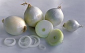Several White Onions; One Cut in Half