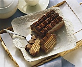 Cold dog (chocolate biscuit cake) on china dish