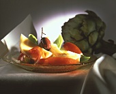Artichoke bottom salad with tomatoes, olives & basil