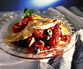 Crepe with mixed berries and flaked almonds