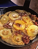 Bacon pancake with apple rings in pan