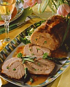 Roast veal roll stuffed with green asparagus