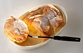 Salzburg dumplings in casserole dish & some on server