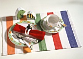 Child's place setting (with Janosch design) on fabric table mat