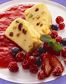 Semolina pudding with raisins & fresh berries on berry sauce