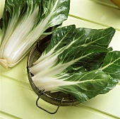 Chard leaves in strainer and chard plant