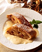 Two pieces of apple strudel with custard