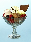 Ice cream sundae with 5 scoops of ice cream, berries & cream