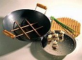 A Wok with assorted Utensils
