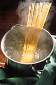 Spaghetti in a pan of boiling water