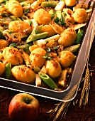 Mustard potato gratin with apples & leeks on baking sheet