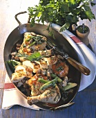 Braised chicken with vegetables & mushrooms in roasting dish