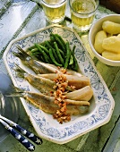 Matjes herrings with bacon & green beans on serving dish