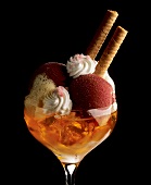 Ice cream sundae: blueberry ice cream, cream & orange jelly 
