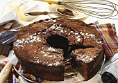 Mississippi mud cake (round chocolate cake), a piece cut 