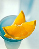 Two Orange Wedges on Frosted Blue Goblet