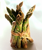 A bundle of greeny-violet asparagus