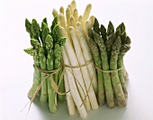 A bunch each of green, white and green & purple asparagus