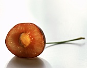 Half of a Red Cherry with Pit Showing