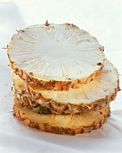 Pineapple slices, unpeeled