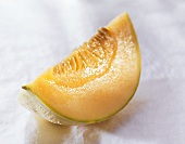 Cantaloupe melon, an eighth on white background