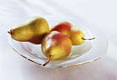 Three Williams pears in a bowl