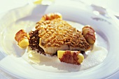 Pike-perch on lentils with potatoes & bacon on plate