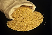 Amaranth in front of a small linen sack