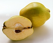 Quince and quince half on white background