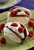 Meringues filled with raspberries and cream