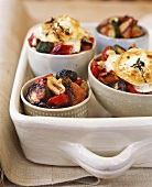 Roasted vegetables in bowl with toasted goat's cheese