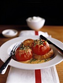 Baked tomatoes with mustard sauce & bread in deep plate