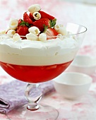 Strawberry trifle with white chocolate in a glass bowl