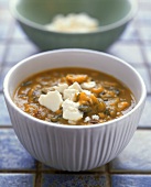 Pumpkin soup with garlic, rosemary and feta