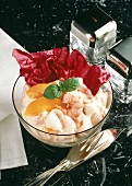 Shrimp cocktail with peaches in glass bowl