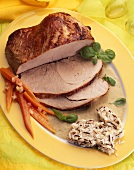Roast pork with rice in shape of hare and herb sauce