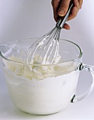 Whipping cream with a egg whisk