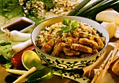 Crispy fish with sesame with vegetable rice in bowl