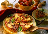 Potato tortilla with tomatoes, pepper and parsley