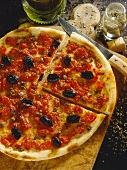 Pizza marinara (pizza with olives and anchovies, Italy)