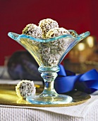 Coconut truffles in blue glass bowl
